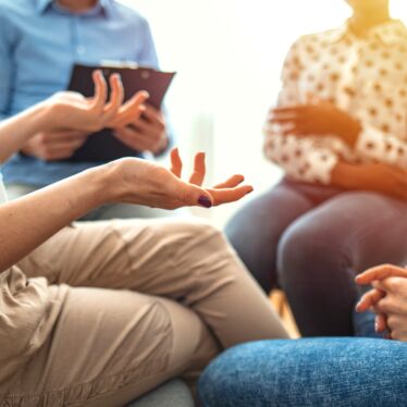 Group session with woman talking