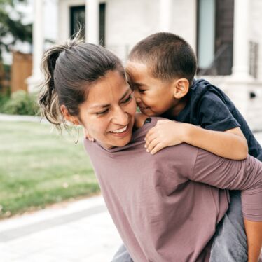 Woman with boy on her back