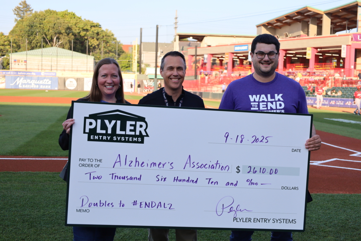 Plyler Entry Systems team presenting donation check to the Alzheimer’s Association
