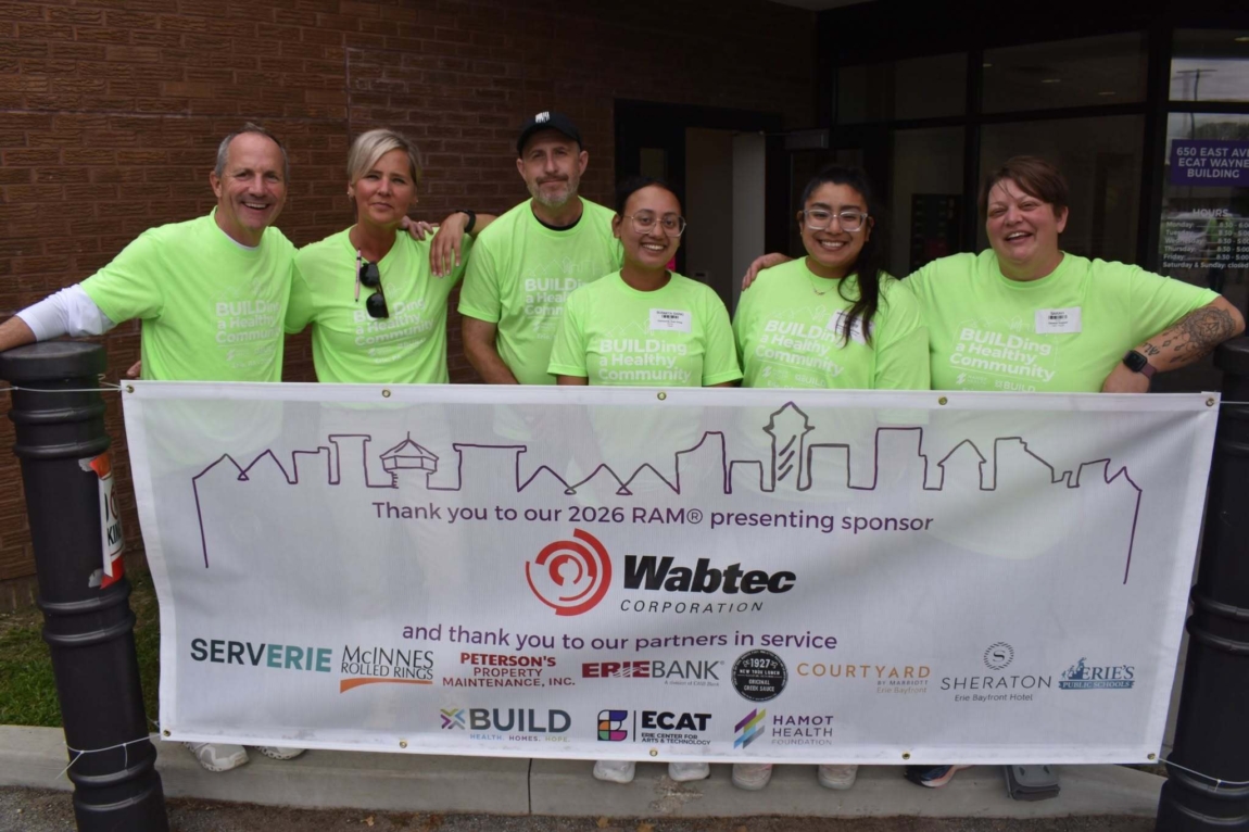 HHF Team with a thank you banner