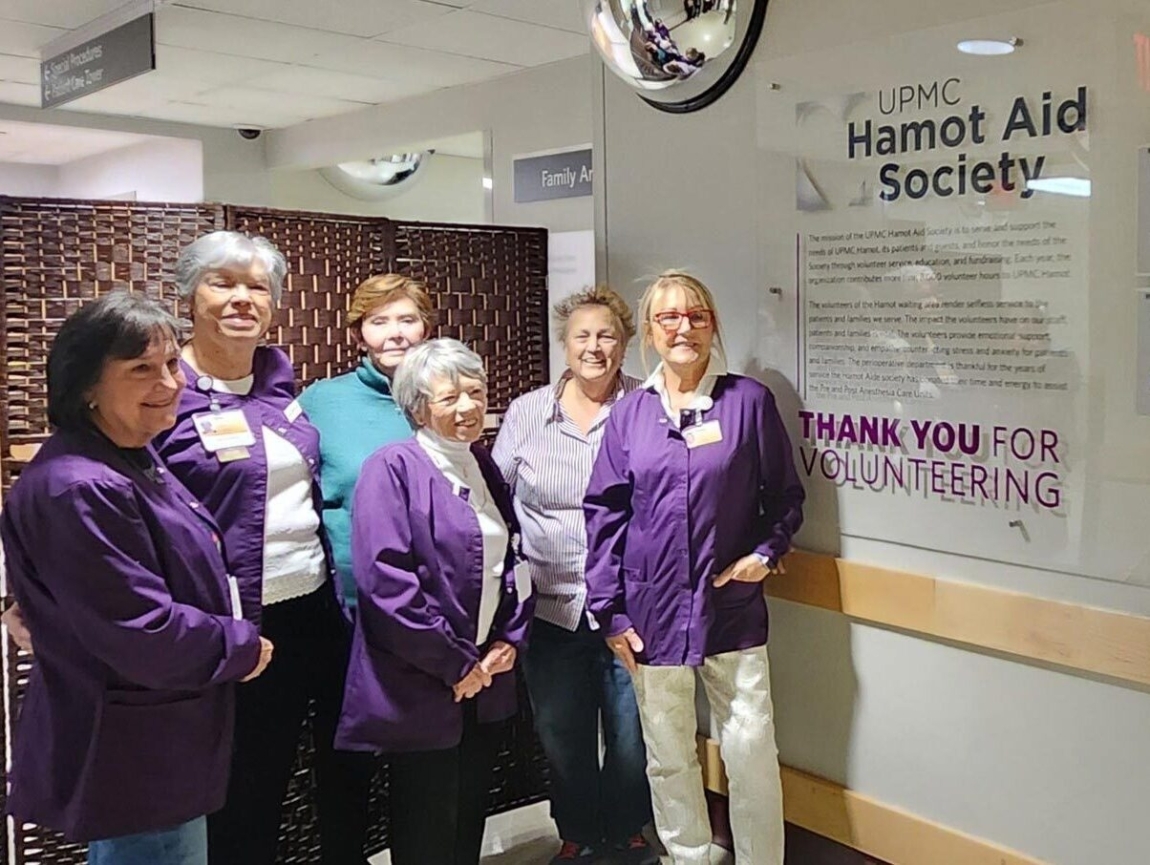 HAS members in the hallway thank you wall