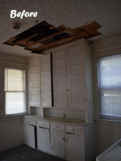 Kitchen with torn up ceiling