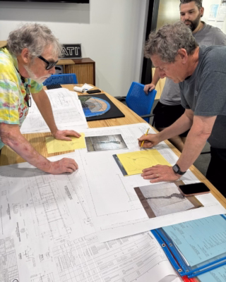 Artists at Table Reviewing Hidden Creeks Installation Plan