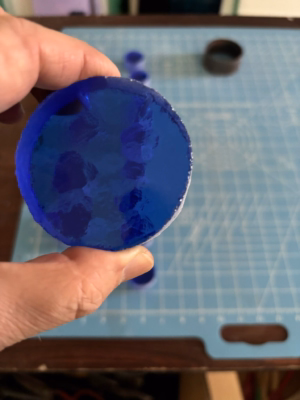 Close up of a blue glass disc