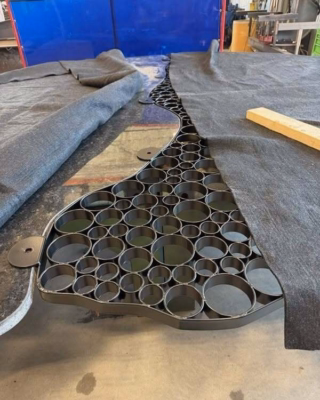 Attaching metal rings to the granite slab.