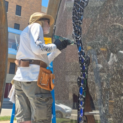 Ed attaching glass to metal rings