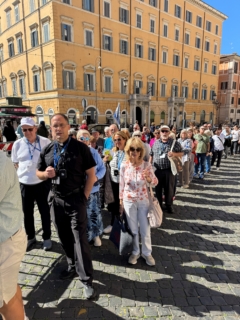 Group prayer approaching holy doors
