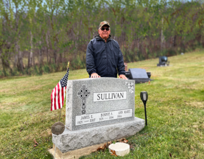 Paul Sullivan at his parents' grave in Saint Raphael Cemetery