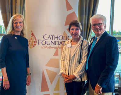 Lisa Louis, Executive Director of the Catholic Foundation with Jane and Mike Zavasky