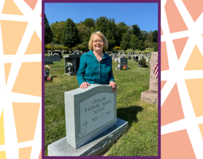 Yvonne Gralak at her headstone in Saint Joseph Cemetery