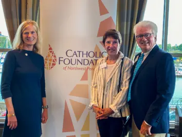 Lisa Louis, Executive Director of the Catholic Foundation with Jane and Mike Zavasky