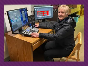 Maureen Allen prepares to live-stream a recent Sunday Mass.