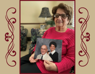 Janet Mehall holding a photo of herself and her husband, Frank