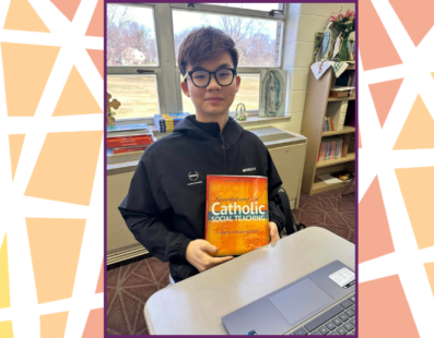 Kennedy Catholic student with new theology textbook