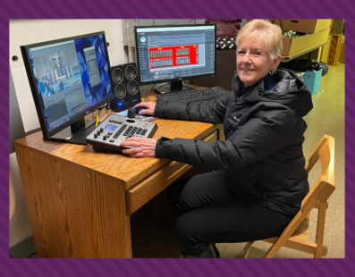 Maureen Allen prepares to live-stream a recent Sunday Mass.