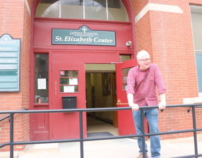 Director Douglas Kennedy in front of the St. Elizabeth Center