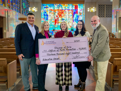 Mike Vereb (Foundation Board Member, L) and Lisa Louis (Executive Director) present grant check to Jillian Zaczyk (Executive Director, Faith Formation), Kate Wilson (Director, Marriage and Family Life) and Aaron Kerr (Director, Catechesis and Sacraments).