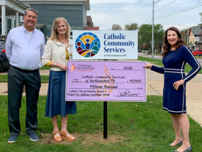 Mike Lewis, Foundation board member, and Lisa Louis, Executive Director, present grant check to Dr. Dawn Joy, CEO of Catholic Community Services of NWPA.